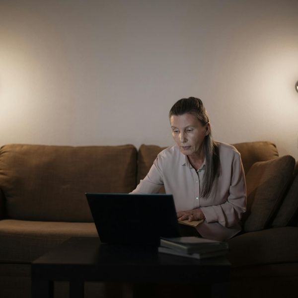 A cozy and quiet corner of a room with a yoga mat.